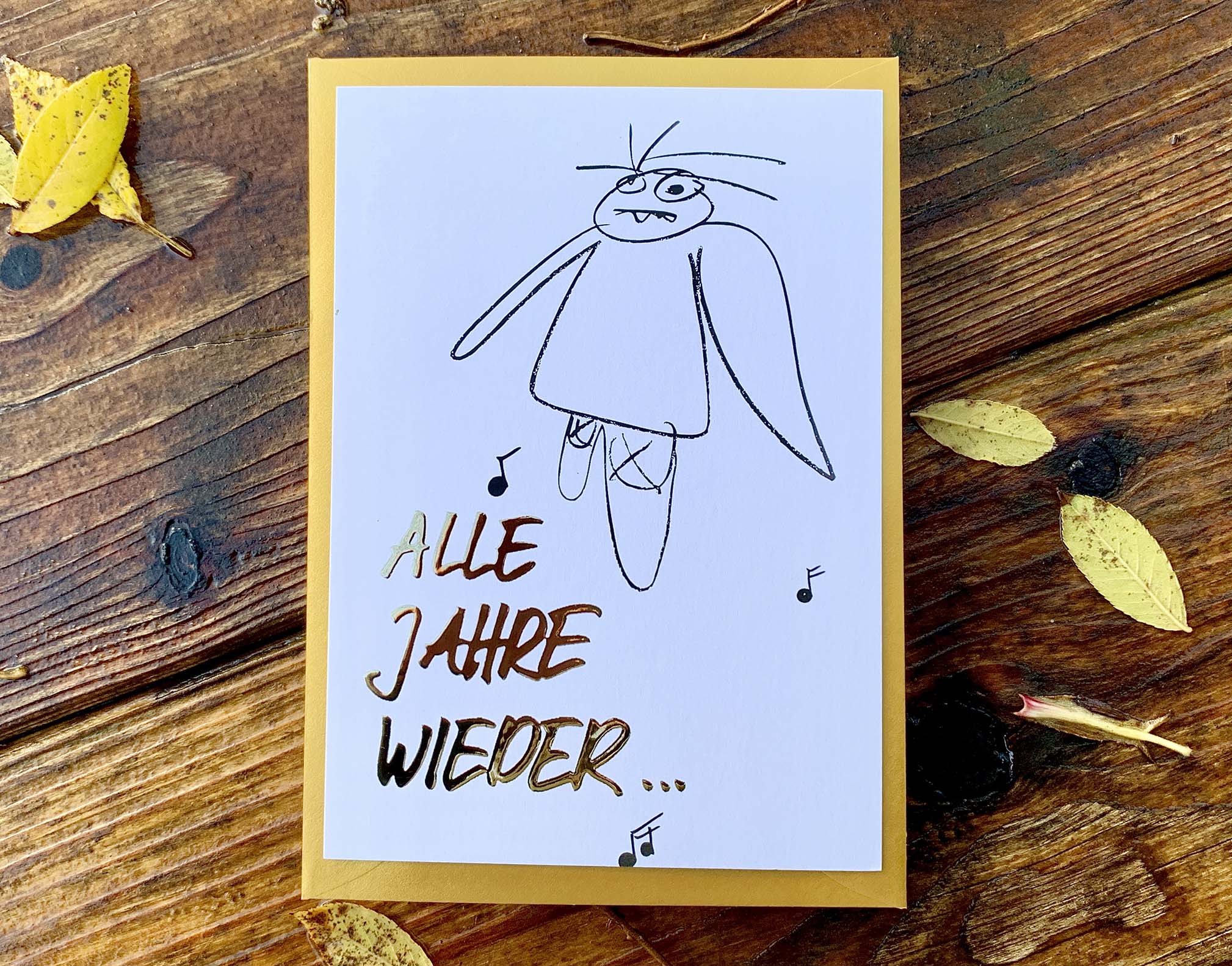 Weihnachtskarte „ ALLE JAHRE WIEDER… müder Engel“ mit goldenem Kuvert – stilvolle und humorvolle Postkarte für Weihnachten und Engel-Liebhaber. Frontansicht